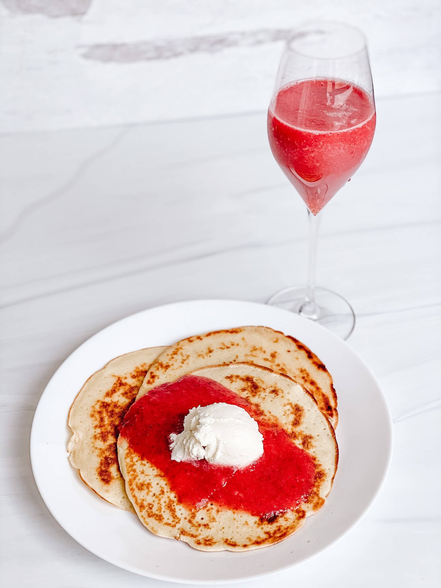 The perfect bubbly breakfast:  champagne crepes, Champage whipped cream, strawberry champagne 