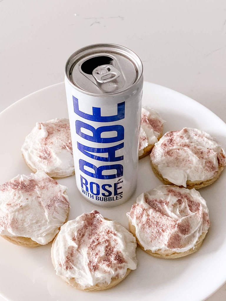 Sparkling rosé frosted sugar cookies with Drink Babe bubbly.