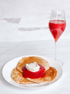 Best Mother's Day Breakfast Menu with bubbly crepes, bubbly whipped cream and bubbly strawberries.
