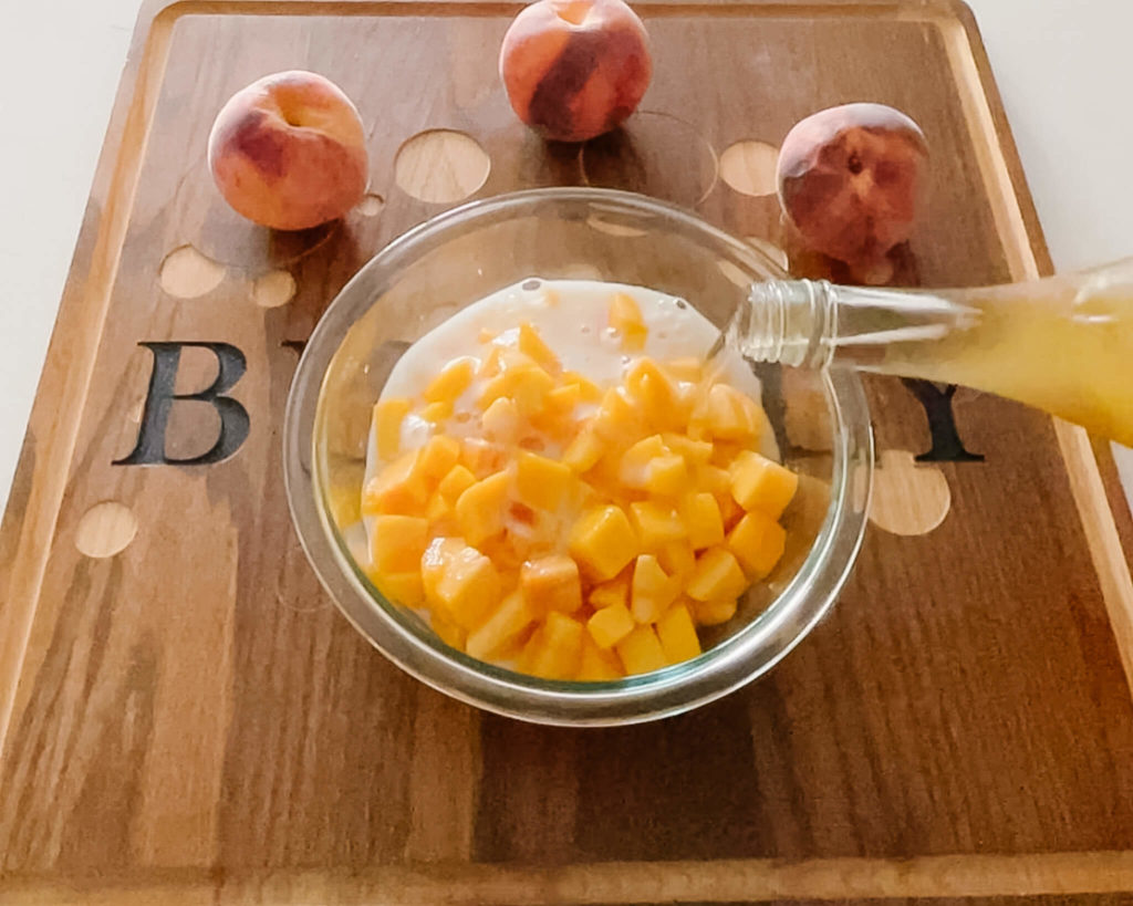 The key to your bubbly peach cobbler is soaking your peaches in peach sparkling wine for at least 2 hours.