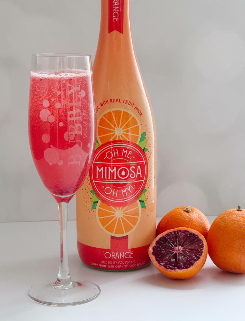 A super easy blood orange mimosa cocktail using fresh blood orange juice and an Aldi pre-made mimosa.